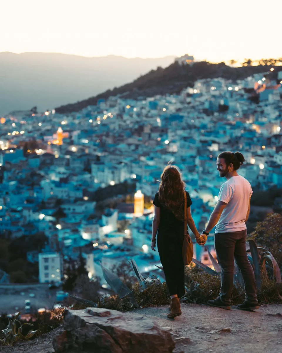 A couple walking side by side outdoors