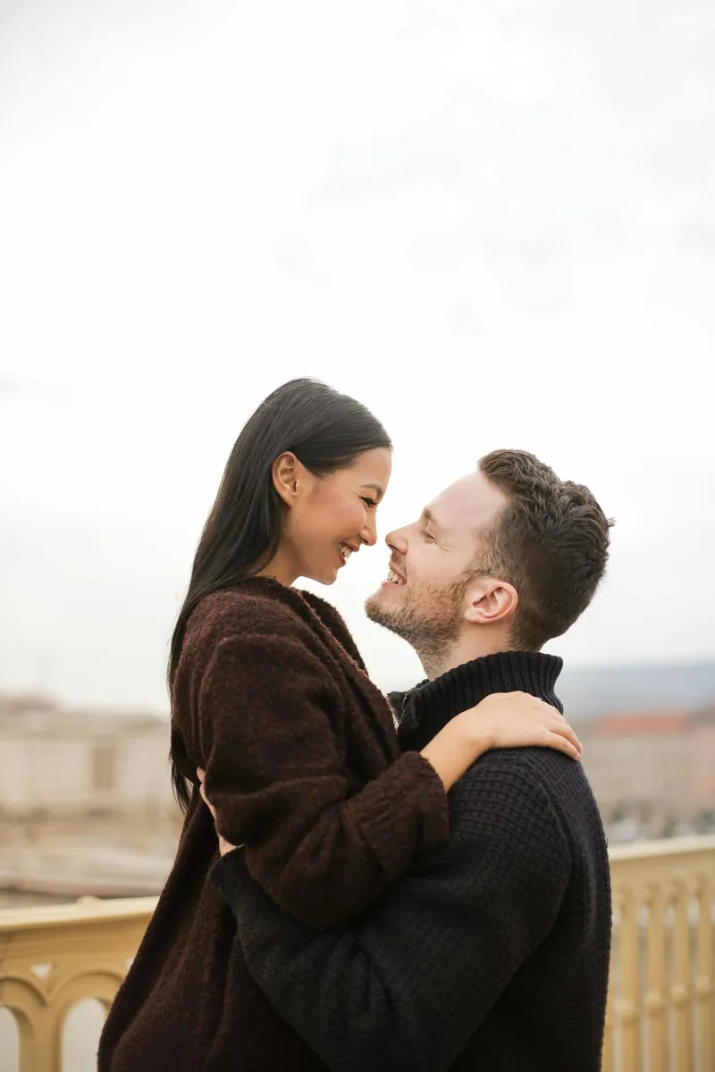 A couple smiling closely at each other